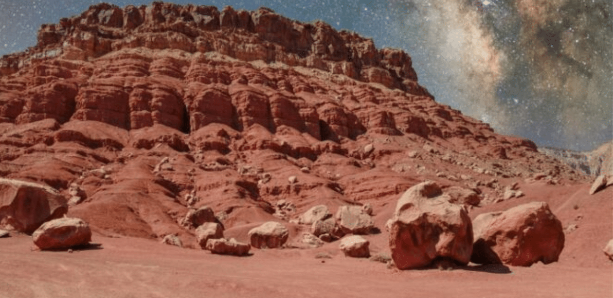 Formação rochosa em Marte revela descoberta geológica com estrutura mineral incomum sob céu estrelado