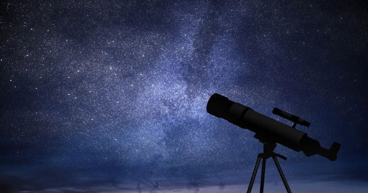 Céu estrelado com telescópio apontado para as estrelas, representando a olimpíada de astronomia.