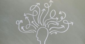 Ilustração conceitual de hormônios e saúde mental representada por cabeça humana com múltiplas setas simbolizando processos emocionais.